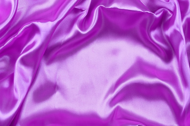 Fioletowe tło pomarszczonej tkaniny do projektowania w koncepcji pracy.
