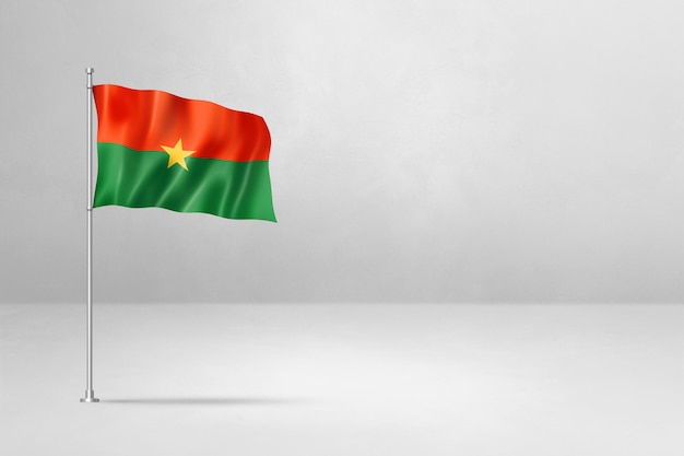 Flaga Burkina Faso odizolowana na tle białej ściany betonowej