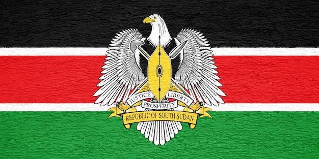 Flaga i herb Republiki Sudanu Południowego na teksturowanym tle