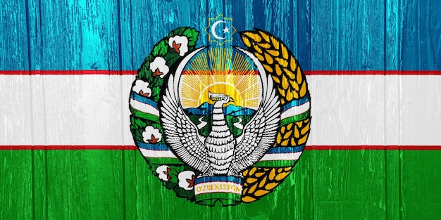 Flaga i herb Republiki Uzbekistanu na teksturowanym tle