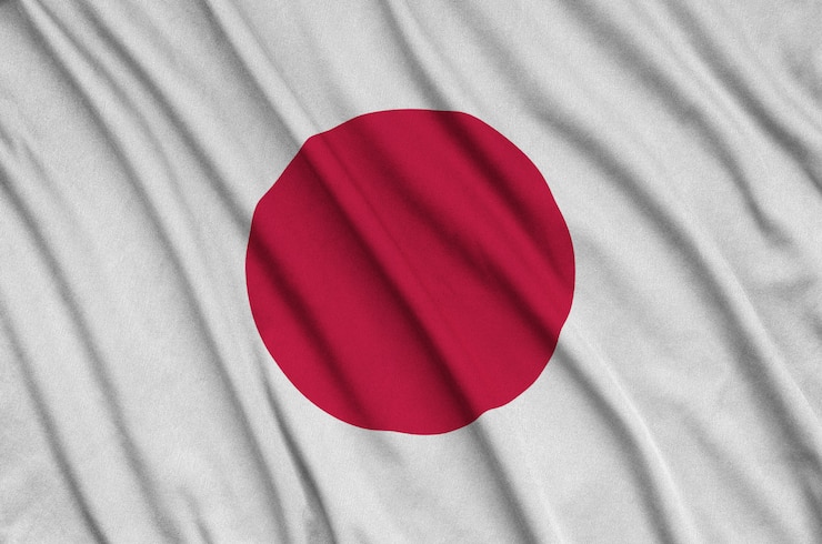 Zdjęcie flaga japonii jest przedstawiona na sportowej tkaninie z wieloma zakładkami.