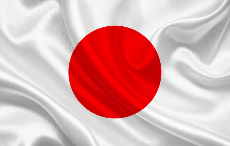 Zdjęcie flaga japonii na tle panoramy falistej tkaniny jedwabnej - ilustracja