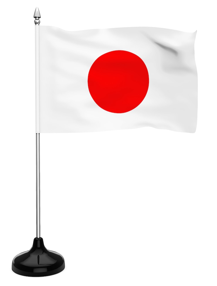 Zdjęcie flaga japonii wisząca na maszcie na białym tle