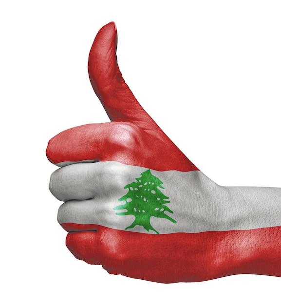 Flaga Libanu pod ręką wskazująca zgodę na białym tle