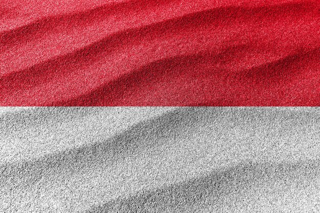 Flaga Monako piaskowa flaga narodowa piaskowe tło