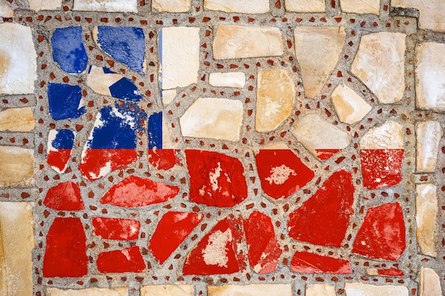 Flaga narodowa Chile na tle kamiennego muru Flaga banerowa na tle kamiennej tekstury