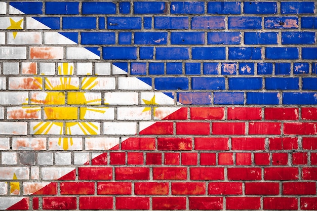 Flaga narodowa Filipin na tle cegły grunge