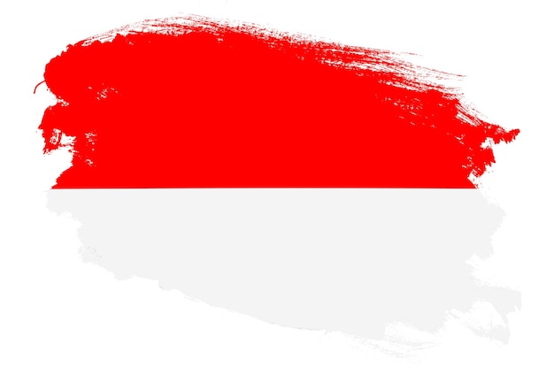 Zdjęcie flaga narodowa indonezji na grunge obrysu pędzla teksturowanej białym tle