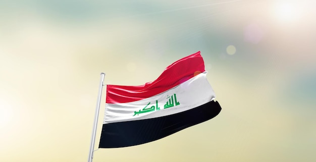 Flaga narodowa Iraku macha na niebie