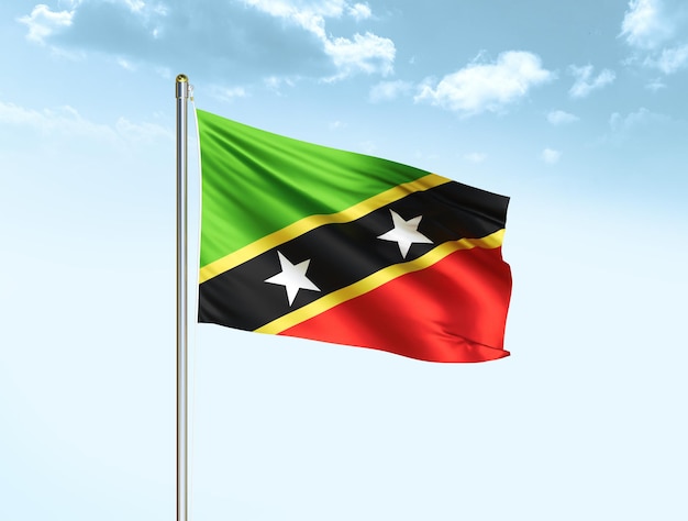 Flaga narodowa Saint Kitts i Nevis machająca na błękitnym niebie z chmurami Flaga Saint Kitts i Nevis