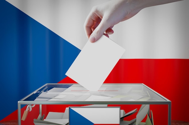 Flaga Republiki Czeskiej ręka upuszczająca kartę do głosowania w koncepcji wyborów w polu głosowania