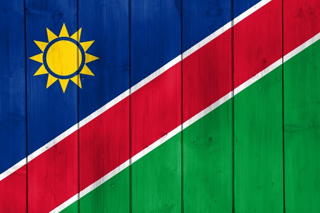 Flaga Republiki Namibii na teksturowanym tle Koncepcyjny kolaż