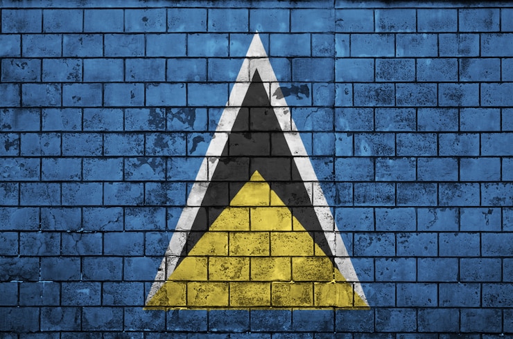Zdjęcie flaga saint lucia jest namalowana na starym murem