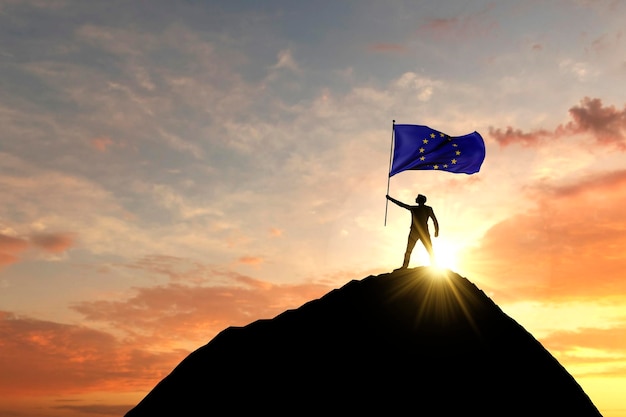Flaga Unii Europejskiej machana na szczycie górskiego szczytu d rendering