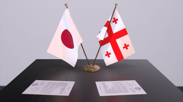 Flagi narodowe Gruzji i Japonii umowa polityczna spotkanie dyplomatyczne Polityka i biznes