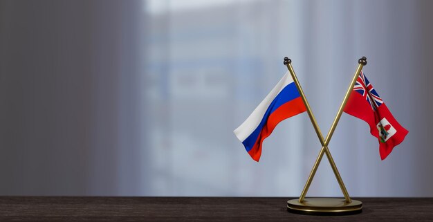 Flagi Rosji i Bermudów na stole Negocjacje między Bermudami a Rosją w sprawie małego rozmycia tła Praca 3D i obraz 3D