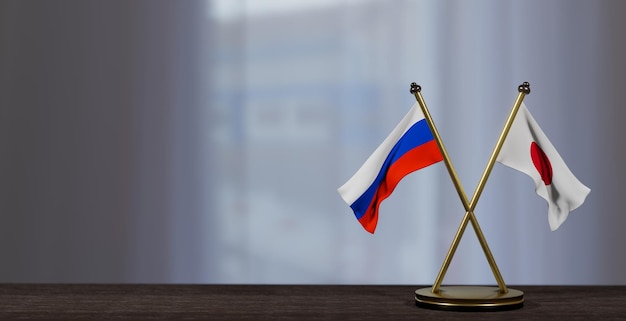 Flagi Rosji i Japonii na stole Negocjacje między Japonią a Rosją w sprawie małego rozmycia tła Praca 3D i obraz 3D