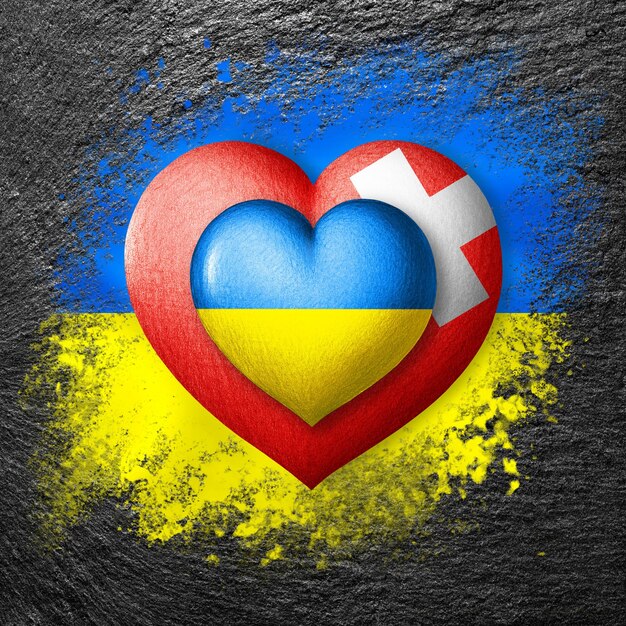 Flagi Ukrainy i Szwajcarii Dwa serca w kolorach flag na fladze Ukrainy