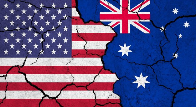 Flagi USA i Australii na pękniętej koncepcji relacji politycznych na powierzchni