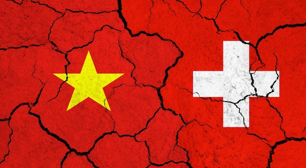 Flagi Wietnamu i Szwajcarii na pękniętej koncepcji relacji politycznych na powierzchni