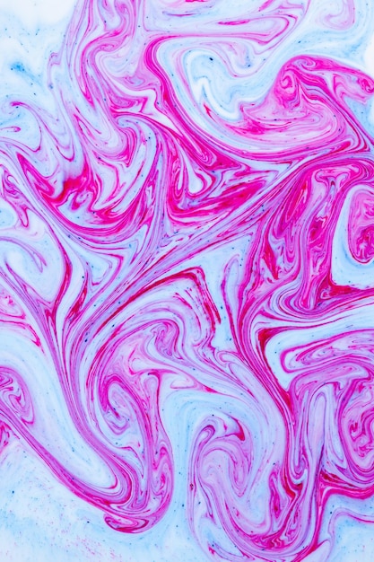 Zdjęcie fluid art z różowo-niebieskim kolorem abstrakcyjne wielokolorowe tło kolorowe plamy farby w cieczy
