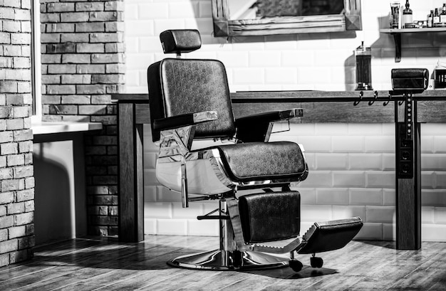 Fotel fryzjerski nowoczesny salon fryzjerski i salon fryzjerski dla mężczyzn Stylowy fotel fryzjerski w stylu vintage Czarno-biały