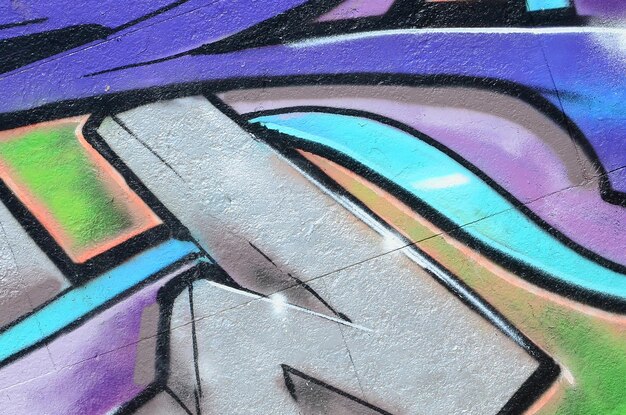 Zdjęcie fragment rysunków graffiti stara ściana ozdobiona plamami farby w stylu sztuki ulicznej