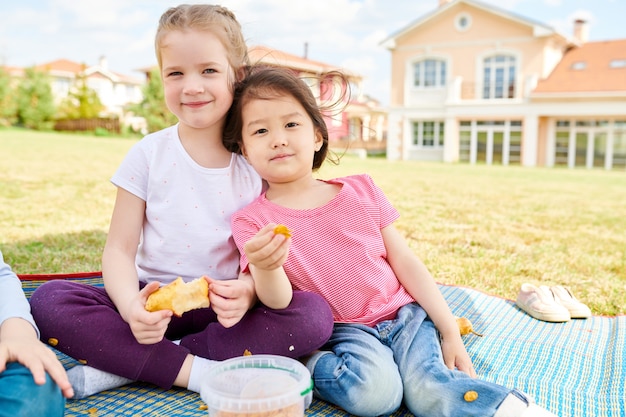 Girls Enjoying Picnic Outdoors