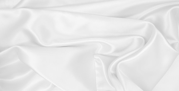 Gładka elegancka biała jedwabna lub satynowa luksusowa tekstura tkaniny jako tło ślubu