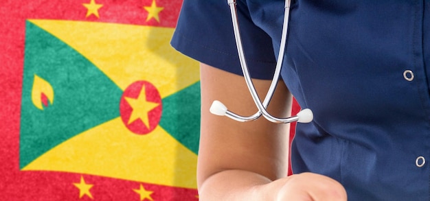 Grenada flag kobieta lekarz ze stetoskopem, krajowy system opieki zdrowotnej