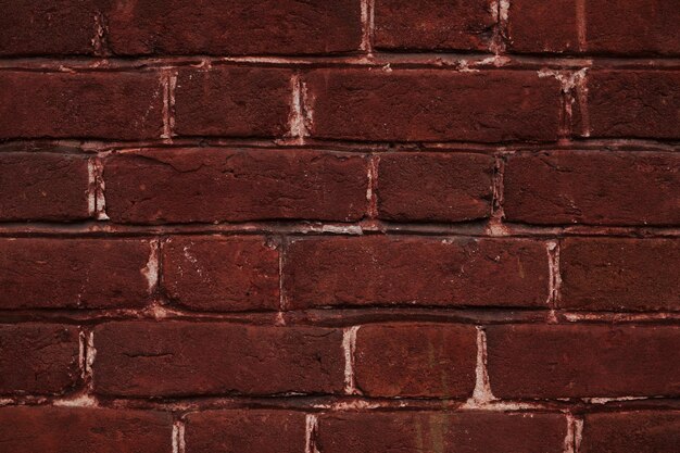 Zdjęcie grunge ceglany mur czerwona cegła ściana tekstury grunge tło z winietowanymi narożnikami do wystroju wnętrz