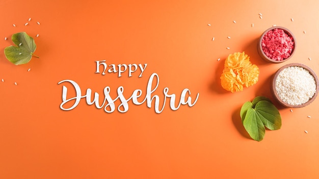 Happy Dasera Żółte kwiaty zielony liść i ryż na pomarańczowym tle Koncepcja festiwalu indyjskiego w Dasera
