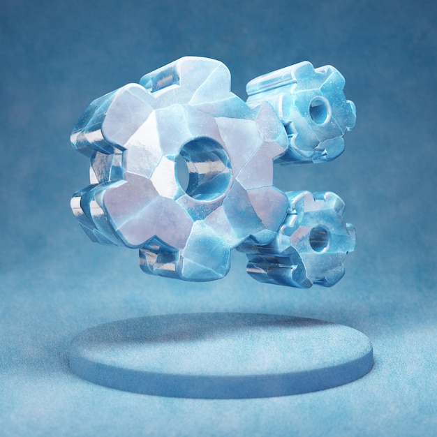 Ikona kół zębatych. Pęknięty niebieski symbol Ice Cog Wheels na niebieskim podium śniegu. Ikona mediów społecznościowych na stronie internetowej, prezentacji, element szablonu projektu. renderowania 3D.