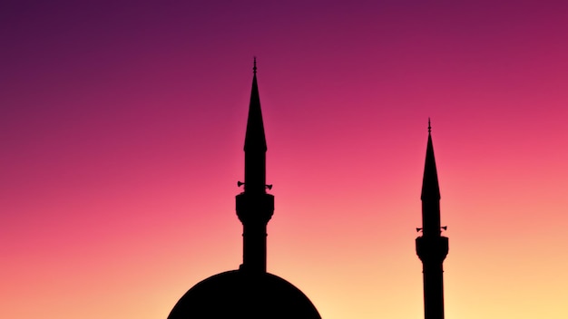 Zdjęcie islamskie święta i specjalne okazje z tłem wizualnym przedstawiającym sylwetkę meczetu