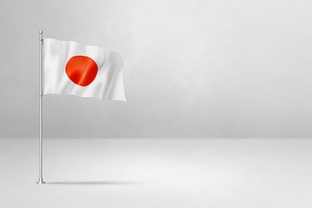 Japońska flaga odizolowana na tle białej ściany betonowej