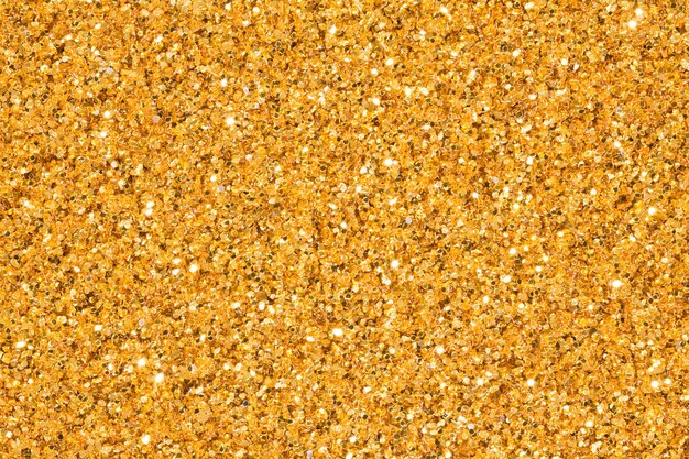 Jasny złoty brokat tło z blaskiem Jasna złota brokatowa tekstura