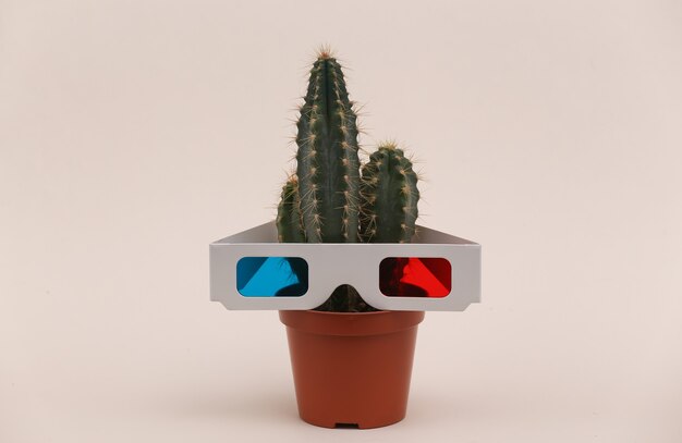 Kaktus w doniczce z okularami 3d na beżowym tle