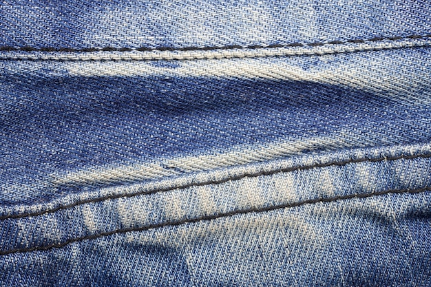 Kieszonkowe niebieskie dżinsy teksturowanej tło.