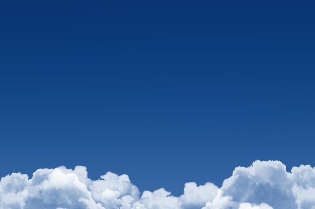 Klasyczne błękitne niebo i puszyste chmury cumulus poniżej tła
