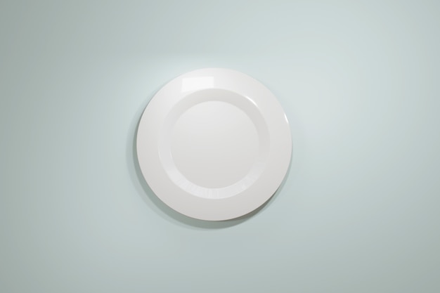 Klasyczny biały talerz ceramiczny do restauracji lub kawiarni z góry na jasnoniebieskim pastelowym tle.