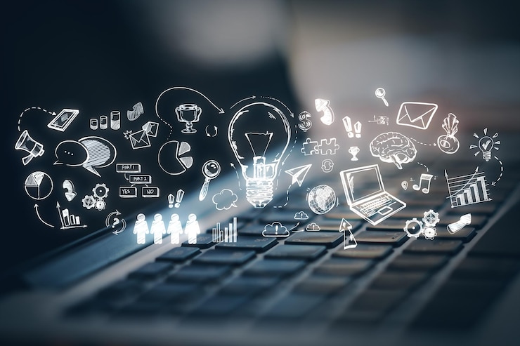 Zdjęcie klawiatura na laptopie z oświetlonym ekranem wyświetlającym kreatywny zestaw rysunków przypominających rysunki symbolizujących pomysły i koncepcje na ciemnym tle
