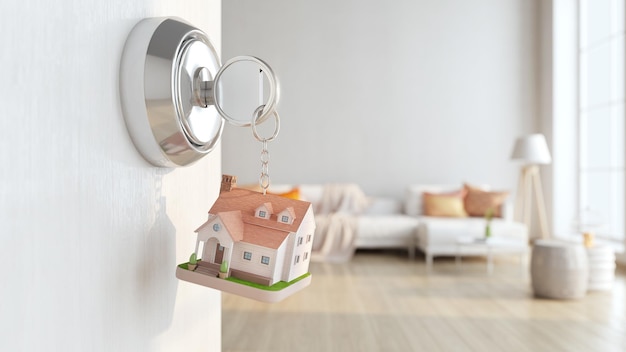 Zdjęcie klucz do domu i model domu z tłem salonu koncepcja dla agenta nieruchomości