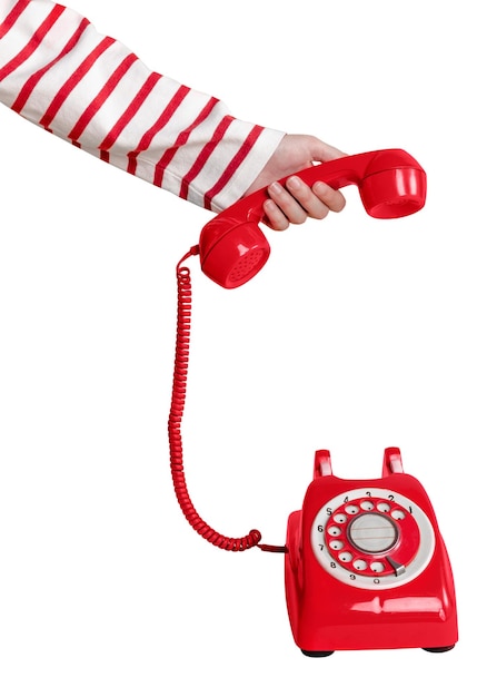 Kobieta odpowiadająca na czerwony telefon w stylu retro