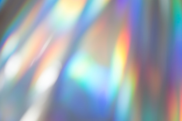 Zdjęcie kolorowa wibrująca holograficzna pastelowej folii tła tekstura. toksyczne zachwyt, tło strony.