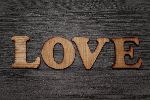 Koncepcja słowa Love Text drewniane litery alfabet typografia na grunge tle