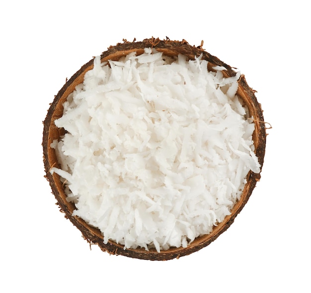 Kraciasty kokos w łupinach na białym tle Selekcyjna ostrość