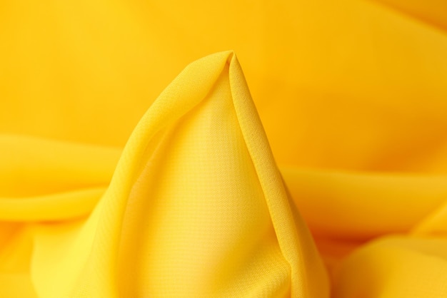 Kształtna żółta tkanina jako tło