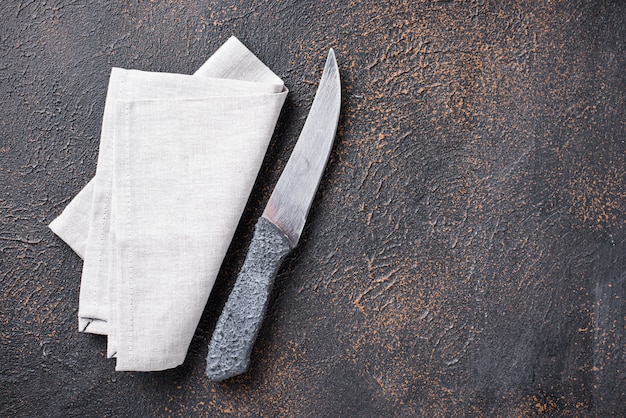 Kulinarny tło z nożem i pieluchą