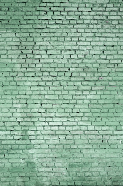 Kwadratowy cegła bloku ściany tło i tekstura. Malowane na zielono