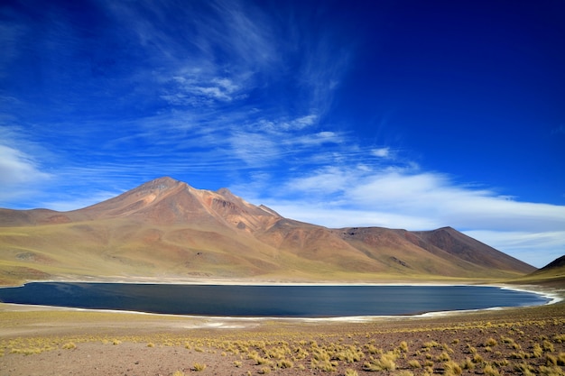 Laguna Miniques lub Miniques lake with Cerro Miscanti volcano at highland of northern Chile